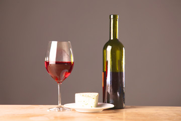 wine bottle and glass on a table