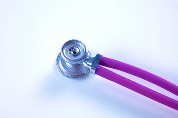 Stethoscope on white table with shallow depth of field for medical college concept