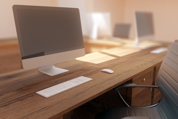 Wooden desk with empty computer