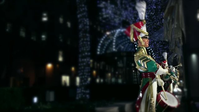 Colorful Christmas nutcracker ornamental drummer statue playing drums with golden flags