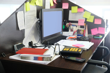 office table with PC and different stationery on it