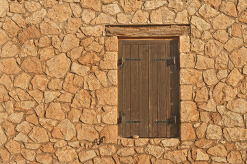 medieval brown window shutters on sunny day