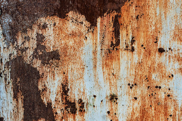 Corroded white metal background. Rusty metal background with streaks of rust. Rust stains. The metal surface rusted spots. Rysty corrosion.