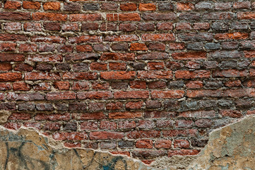 Old brick wall with destroyed stucco. background, texture