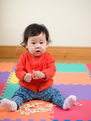 Asian baby girl  learning English letters
