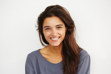 Naklejka premium beautiful female smiling against white background.