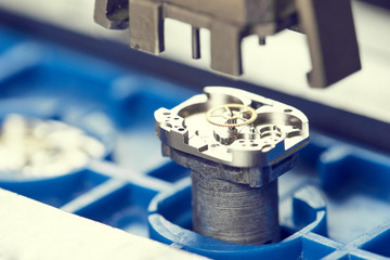 Watch production or clock repair. gear wheel macro view