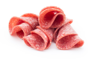 Salami sausage slices isolated on white background.