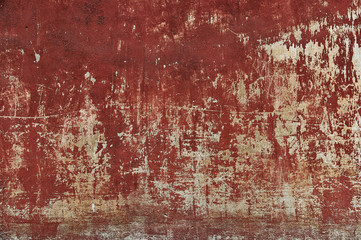 Old scratched and damaged red wall texture