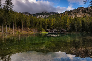 Fototapeta na wymiar Wooden hut in Ghedina lake, Dolomiti, Italy