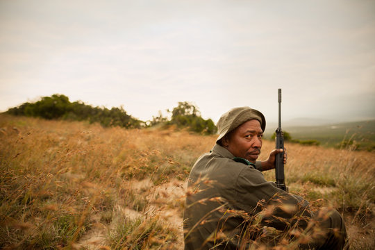 Game warden watching for poachers at a wildlife reserve in South Africa.