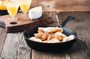 Crepes with bananas and  cream caramel sauce