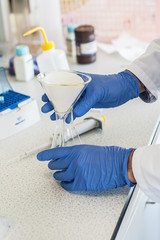 Laboratory technician performs tests