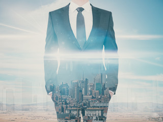 Businessman on city background multiexposure