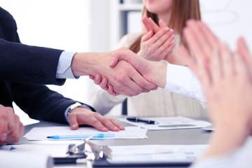 Close up of  two business man shaking hands to each other finishing up the meeting