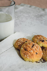cookies and milk are on a white tablecloth