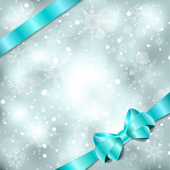 Elegant Christmas background with blue bow, ribbon and snowflake