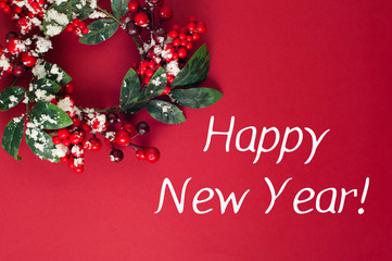 Obraz na płótnie Canvas happy new year. wreath on red background