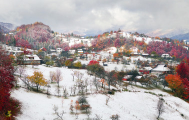 Fototapeta na wymiar First snow fall in the Carpathian village