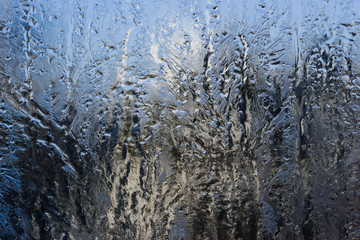 Fototapeta na wymiar Amazing patterns on frosty window