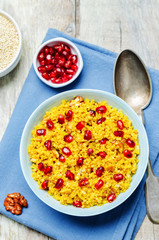 Turmeric quinoa with pomegranate and walnuts