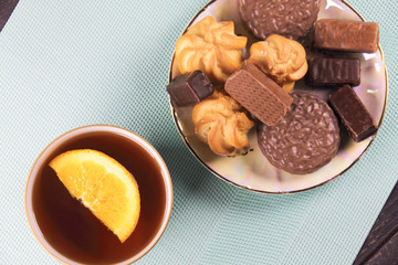 tea and sweets on a mint background