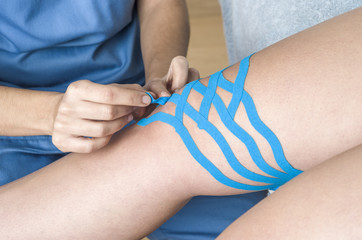 Lymphatic knee technique, two fan strips. Kinesiology Tape