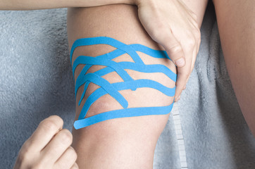 Lymphatic knee technique, two fan strips. Kinesiology Tape