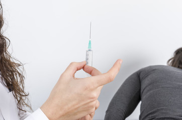 Doctor making vaccination to the patient