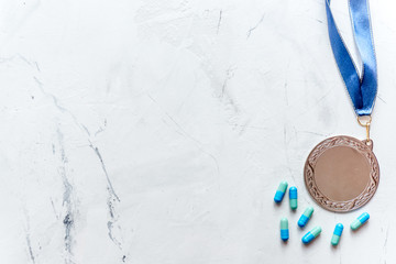 Concept of doping in sport - deprivation medals top view