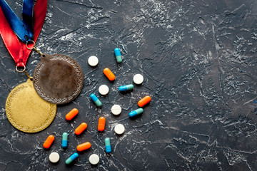 Concept of doping in sport - deprivation medals top view