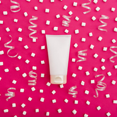 Cream and marshmallows on pink background. Flat lay. Top view