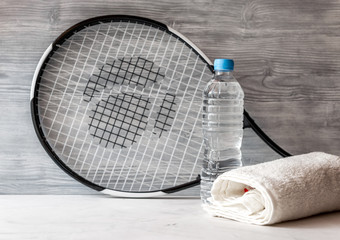 tennis racket on gray background close up
