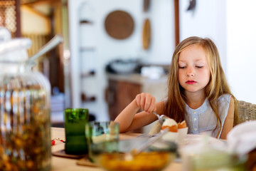 Little girl eating breakfast