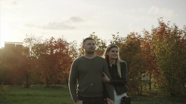 Couple walking in the autumn park HD