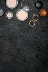 decorative cosmetics nude on dark background top view