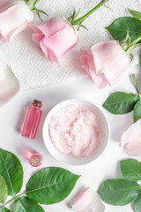 organic cosmetic with rose oil on white background top view