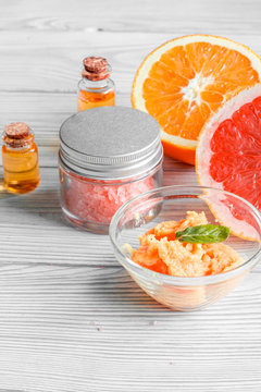 organic cosmetic with citrus on wooden background