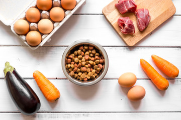 ingredients for pet food holistic top view on wooden background