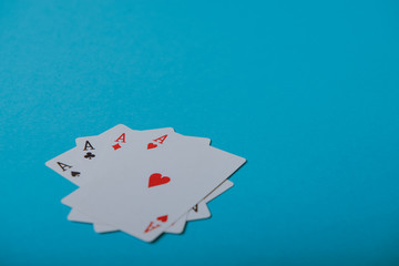 A winning poker hand of four aces playing cards