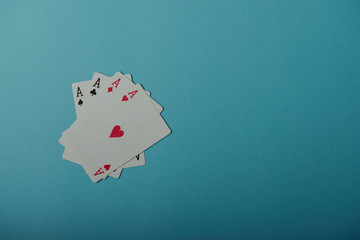 A winning poker hand of four aces playing cards