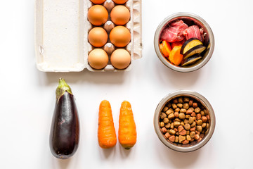 ingredients for pet food holistic top view on white background