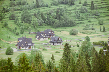 Summer landscape with huts