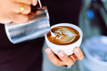 Zelfklevend Fotobehang coffee latte in coffee shop cafe   © chayathon2000