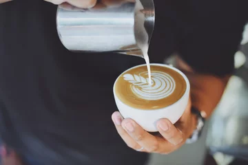 Zelfklevend Fotobehang coffee latte art in coffee shop © chayathon2000
