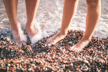 couple relax on beach together