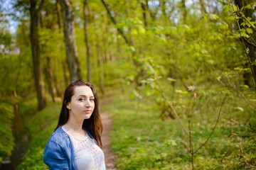 Young girl on a walk in the forest