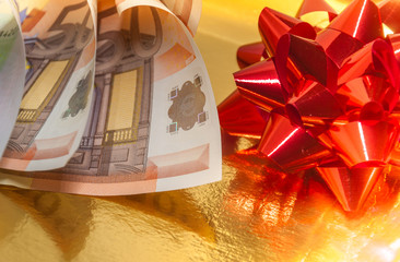 Money and gift bow.