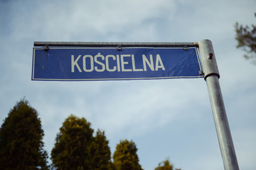 Winding road sign in the forest