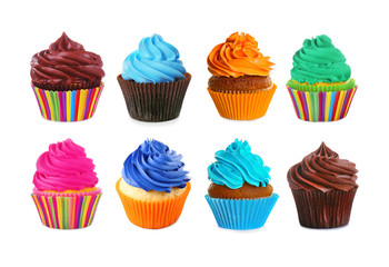 Set of delicious cupcakes on white background